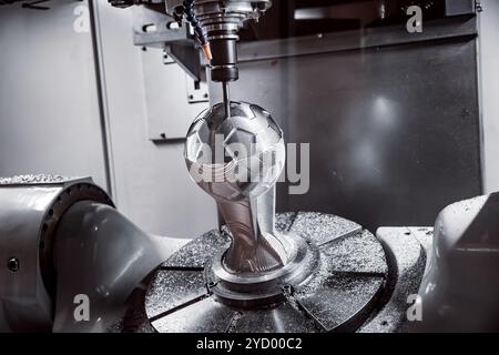 Metalworking CNC milling machine. Cutting metal modern processing technology. Stock Photo