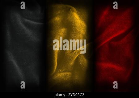 Belgium flag illustration representing the colors of the nation (black yellow gold red) with dark textured fabric background Stock Photo