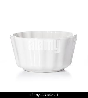 Round ceramic baking tray isolated on white background. Small glazed ceramic ramekin. Stock Photo