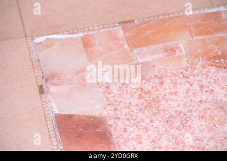 Texture sea pink salt. Useful spa treatments. Pink salt granules. Stock Photo