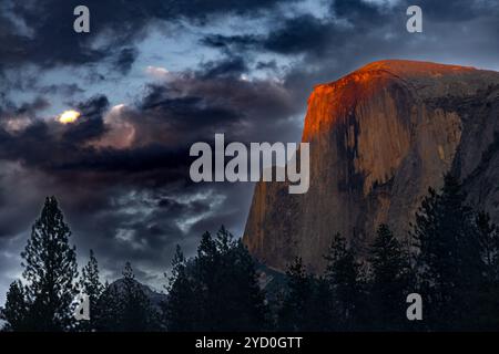 Sunset bathing Half Dome in a special red light Stock Photo