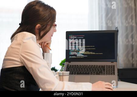 Woman Working And Programming On Computer In Office. Female Programmer Working Looking At Monitor, Typing Data Code In Company Office. Stock Photo