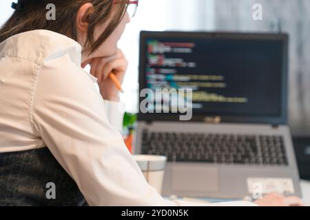 Woman Working And Programming On Computer In Office.woman working on coding on laptop Stock Photo