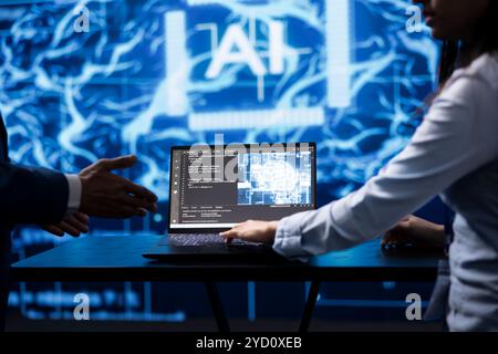 Computer scientist running AI cognitive computing tech on laptop to simulate computerized model. Close up of notebook used by IT specialist in workspace to do data mining with self learning algorithms Stock Photo