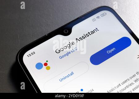 October 24, 2024, Portugal. In this photo illustration, the Google Assistant app logo is displayed on a smartphone screen Stock Photo