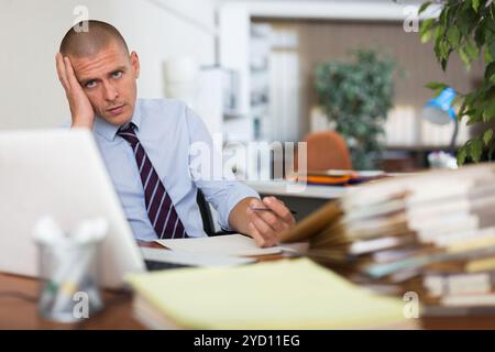 Angry male manager experiencing emotions in office Stock Photo