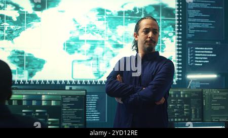 Cybersecurity team investigating cybercrime and malware attacks. IT security experts analyzing threats and protecting national security, working on data protection and privacy. Cyberwarfare. Camera A. Stock Photo