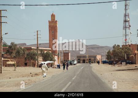 Countryside, Morocco, July 23th 2019: Historic downtown road in Morocco showcasing mixed-use buildings and local transportation Stock Photo