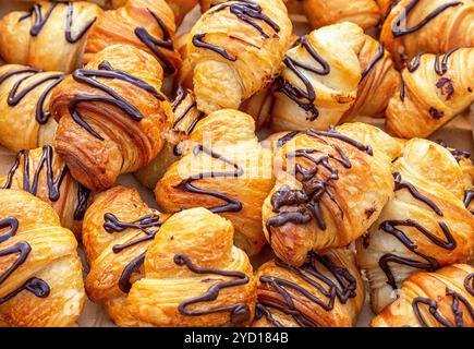 Freshly baked croissants with chocolate glazed Stock Photo