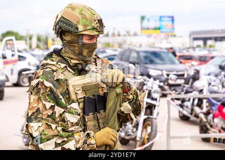 Russian soldier in camouflage army uniform with sniper rifle Stock Photo