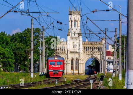 Russian train in the summer. The train is coming to the station. railway. Russia, Leningrad region, Peterhof, June 20... Stock Photo