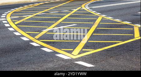 White and yellow road lines on the asphalt Stock Photo