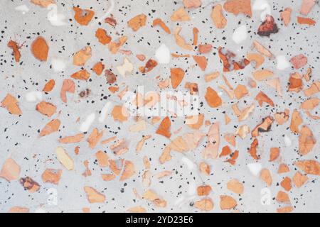 An Abstract Terrazzo Tile with a beautiful mix of Orange and Gray Chips in design Stock Photo
