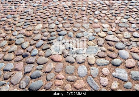 Old cobblestone pavement as background texture Stock Photo