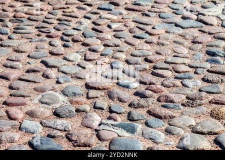 Old cobblestone pavement as creative background Stock Photo