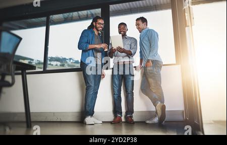Tablet, discussion and designers in startup for research project, website review or collaboration. Creative workplace, lens flare and people on Stock Photo