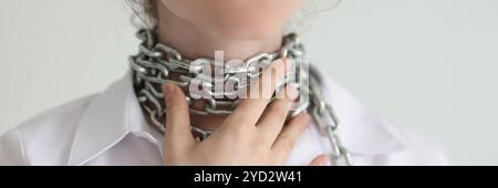 Woman touches wrapped around neck chain feeling throat pain Stock Photo