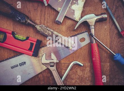 A Collection Of Grungy Workshop Tools On A Wooden Bench Stock Photo