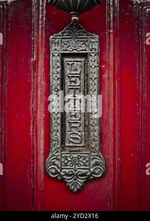 Ornate Old Fashioned British Letterbox Or Mailbox On A Red Front Door Stock Photo