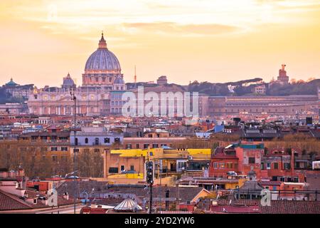 Eternal city of Rome rooftops and Vatican Basilica of Saint Peter golden sunset view Stock Photo