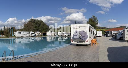 Ouezzane, Morocco, 2 Marhc, 2024: many motor homes and RVs parked around a swimming pool at a hotel in the Rif mountains of northern Morocco, Africa Stock Photo