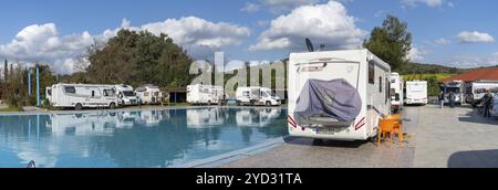 Ouezzane, Morocco, 2 Marhc, 2024: many motor homes and RVs parked around a swimming pool at a hotel in the Rif mountains of northern Morocco, Africa Stock Photo