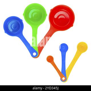 A Set Of Colorful Measuring Cups Or Spoons, Isolated On A White Background Stock Photo