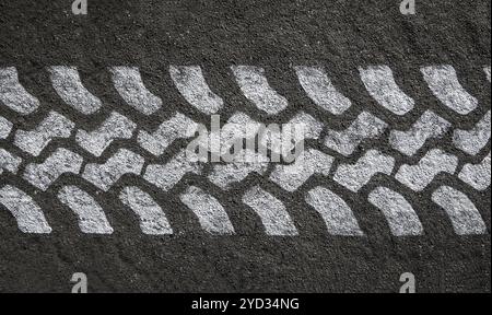 Detail Of A White Painted Tyre Track On Black Asphalt Stock Photo