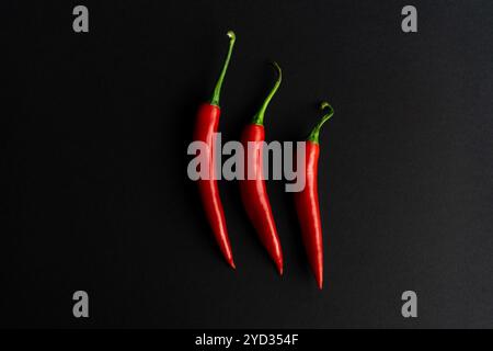 Chili peppers composited perfectly against black backround Stock Photo