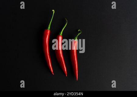 Chili peppers composited perfectly against black backround Stock Photo