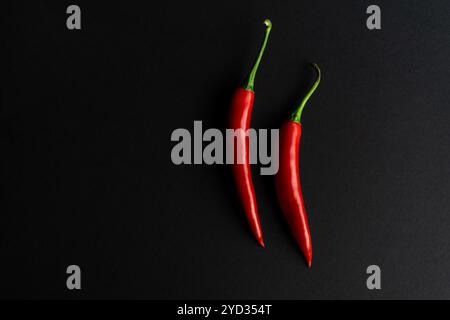 Chili peppers composited perfectly against black backround Stock Photo