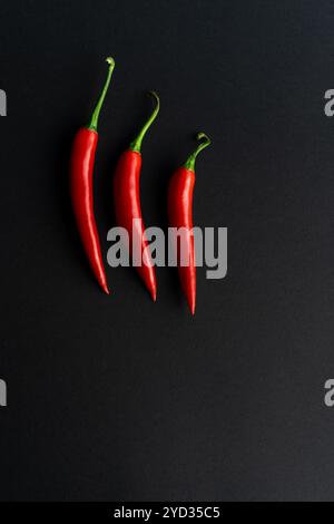 Chili peppers composited perfectly against black backround Stock Photo