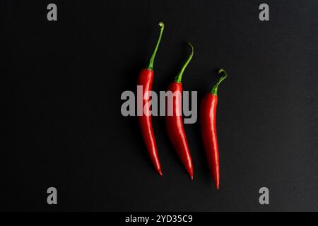 Chili peppers composited perfectly against black backround Stock Photo