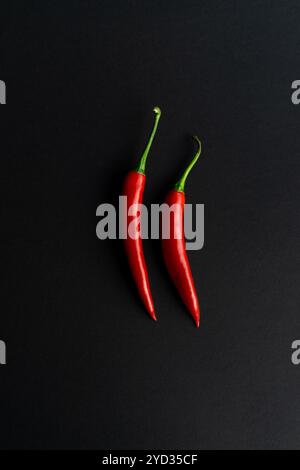 Chili peppers composited perfectly against black backround Stock Photo