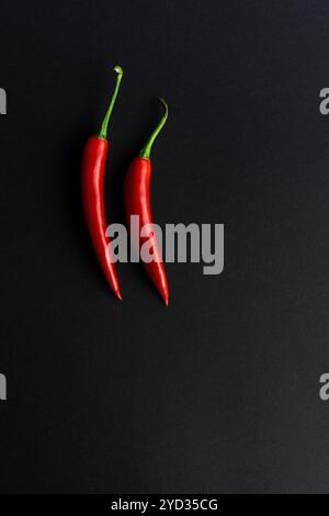 Chili peppers composited perfectly against black backround Stock Photo