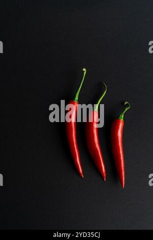 Chili peppers composited perfectly against black backround Stock Photo