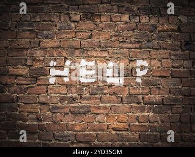 The Word Help Written As Graffiti On A Vintage Red Brick Wall Stock Photo