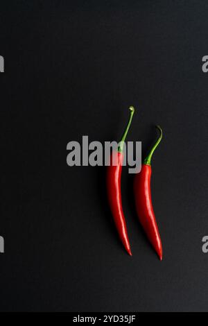 Chili peppers composited perfectly against black backround Stock Photo