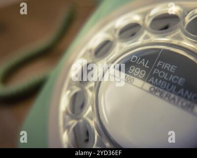 Detail Of UK 999 Emergency Services Numbers On A Retro Vintage Rotary Telephone Stock Photo