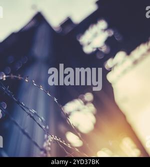 Heavy Industry Abstract Of Barbed Wire In Front Of An Abaondoned Shipbuilding Crane In Glasgow, Scotland, United Kingdom, Europe Stock Photo