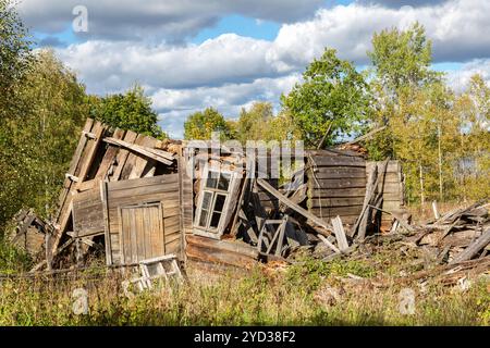 Old wooden broken houses in russian abandoned village Stock Photo