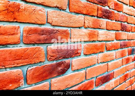 Weathered red brick wall as background Stock Photo