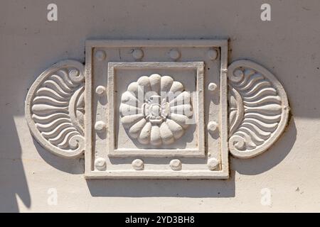Antique metal cast architectural ornament with floral pattern. Stock Photo