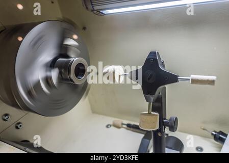 Cnc lathe for polishing surfaces. The CNC lathe machine or Turning machine. Turning numerical control machine with tools and chuck. Inside view of a c Stock Photo