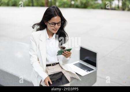Business women computer hardware engineer. Project lead PCB designer looking at sample circuit board ready to mass production. Stock Photo