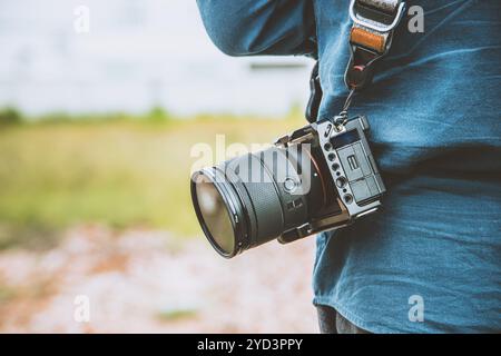 Modern full frame digital camera compact small size, light weight, quick release, agile, high performance with advance focus technology. Stock Photo