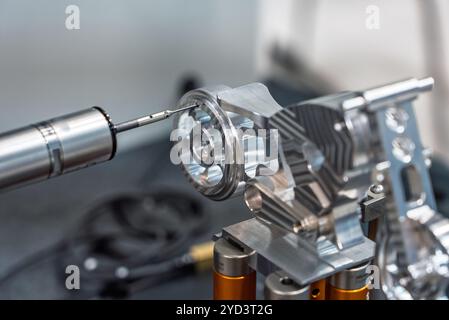 3d precision measurement on machine quality control parts. Measuring machine for finished parts after cnc machining. Measuring machine. 3D coordinate Stock Photo