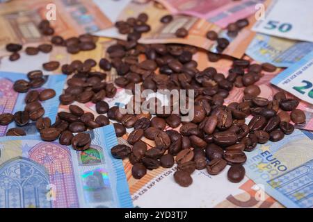 Coffee beans on euro banknotes Stock Photo