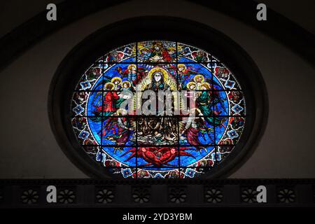 Virgin Mary surrounded by Angels by Lorenzo Ghiberti, 1405, stained glass window in the Cattedrale di Santa Maria del Fiore (Cat Stock Photo