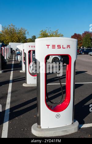 New Tesla Supercharger EV charging points at South Mimms service station, UK, part of the Tesla-only network. South Mimms Services M25 charging area Stock Photo